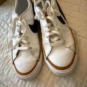 Nike White Sneakers with Black Swoosh and Brown Trim